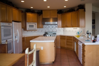 before picture of kitchen cabinets before getting refinished with general finishes stain